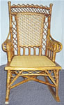 Antique Heywood Wakefield Rocker, ornate design, natural color